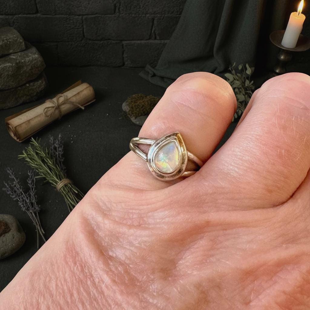Opal Ring - Your hand with mystical background