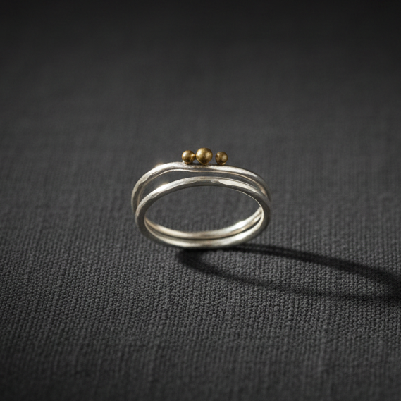 Trinity Moon double band ring studio product shot on dark linen