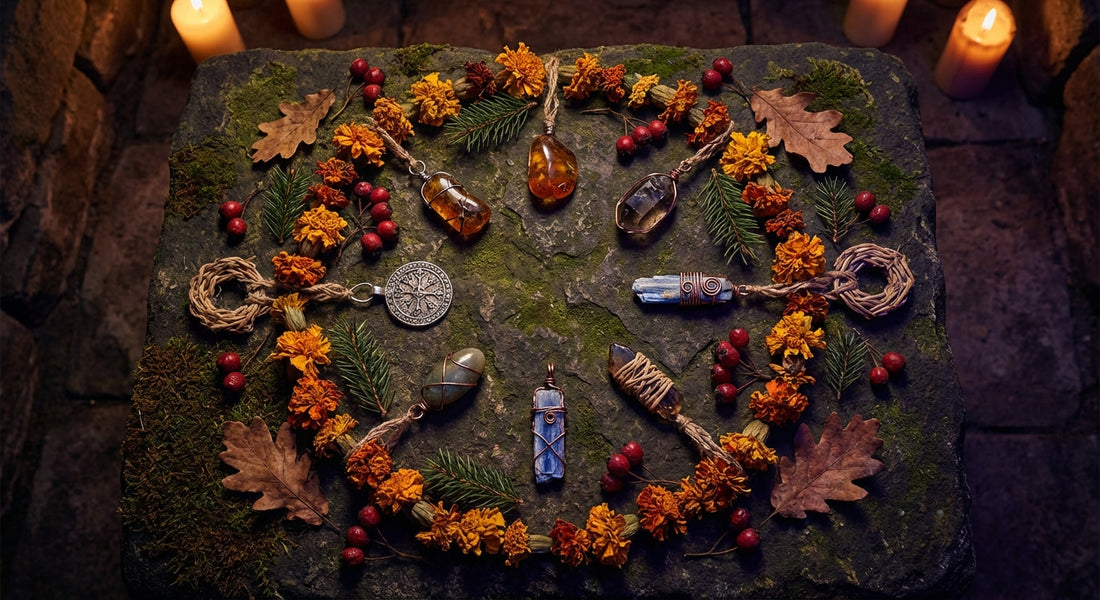 Eight handcrafted talismans and crystals arranged in a sacred wheel pattern on a dark stone surface, surrounded by seasonal botanicals and illuminated by warm candlelight.