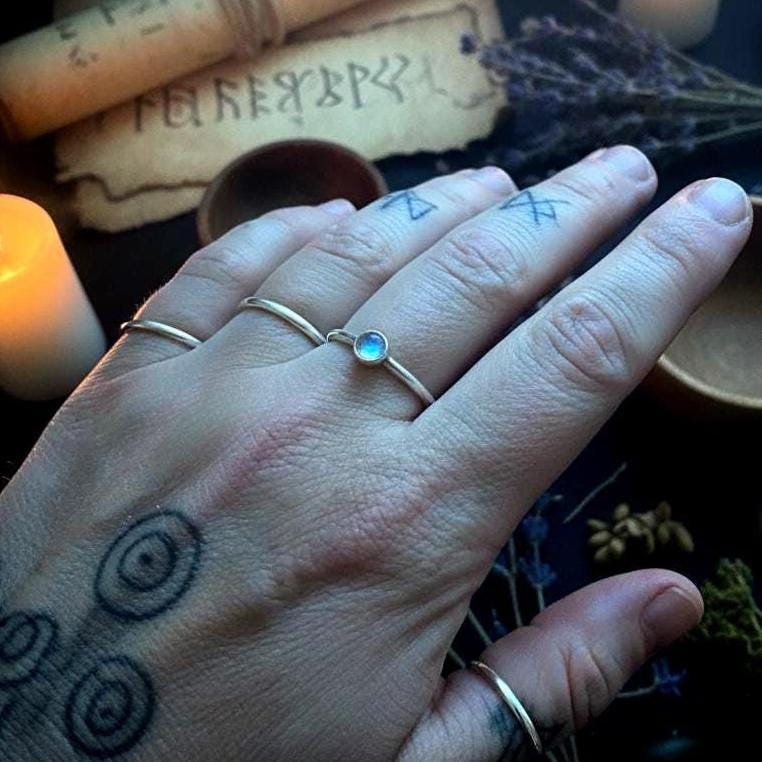 Blue Flash Moonstone Ring - Hand holding