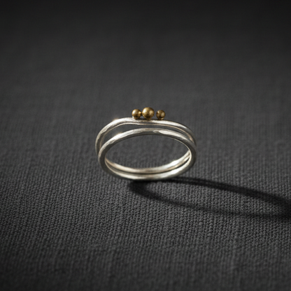 Trinity Moon double band ring studio product shot on dark linen